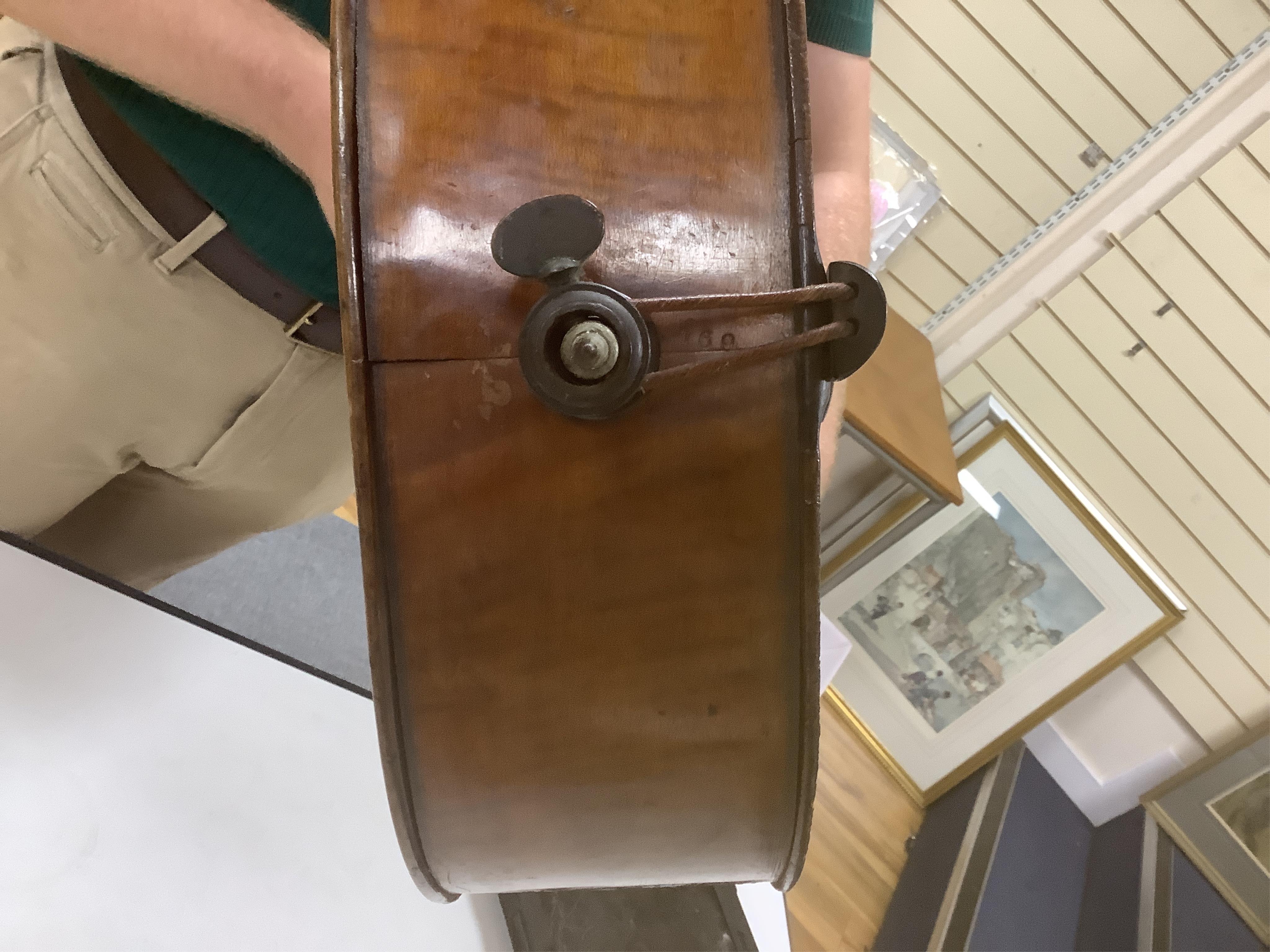 A late 19th century small cello, unsigned and without label inside body, stamped inventory number 769, length of back 62cm. Condition - poor to fair